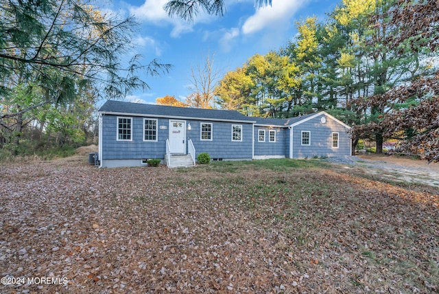 ranch-style home featuring central AC