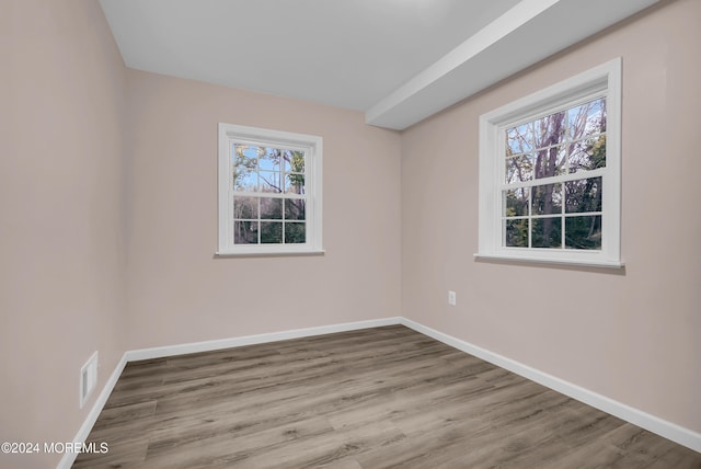 spare room featuring light hardwood / wood-style flooring