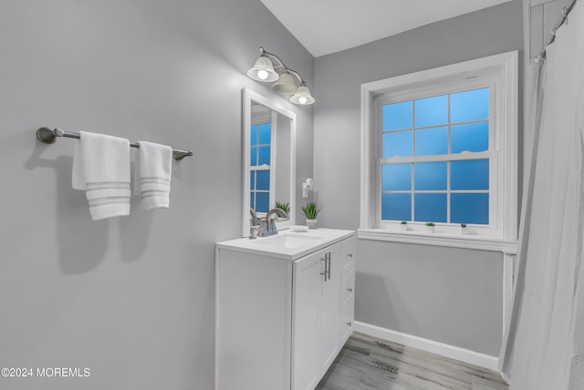 bathroom featuring vanity and wood-type flooring