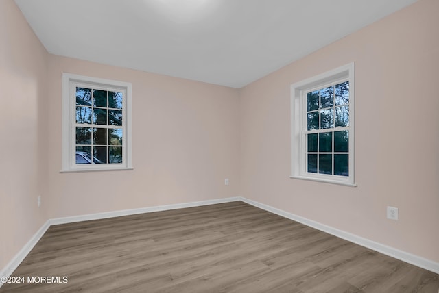 spare room featuring light hardwood / wood-style floors