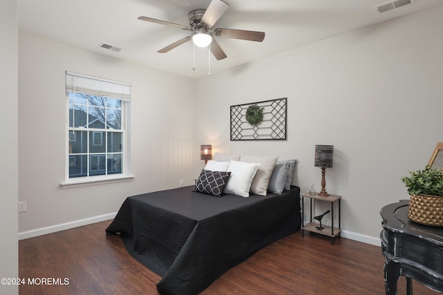 bedroom with ceiling fan and dark wood-type flooring