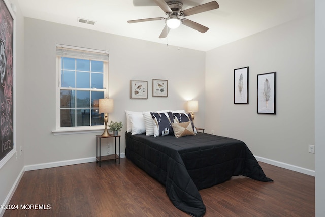 bedroom featuring dark hardwood / wood-style floors and ceiling fan