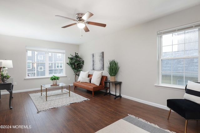 sitting room featuring ceiling fan and dark wood-type flooring