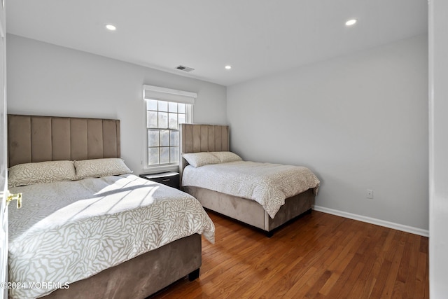 bedroom featuring dark hardwood / wood-style flooring