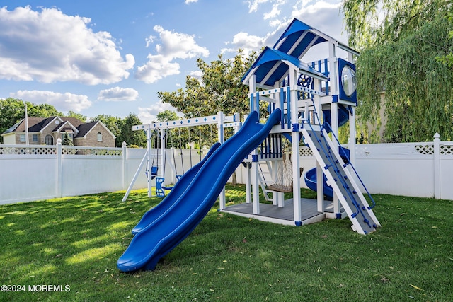 view of playground with a yard