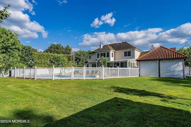 view of yard featuring a gazebo and a fenced in pool