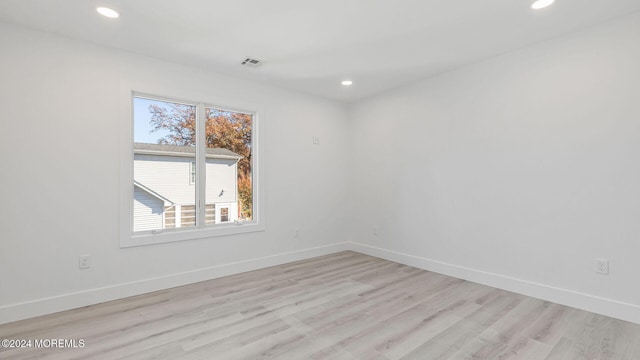 unfurnished room featuring light wood-type flooring