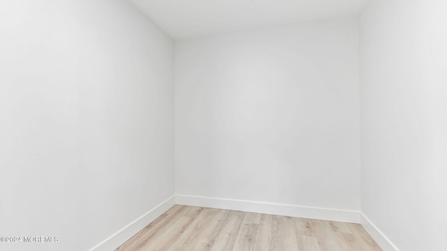 unfurnished room with light hardwood / wood-style flooring