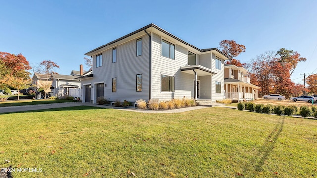 view of front of home featuring a garage and a front yard