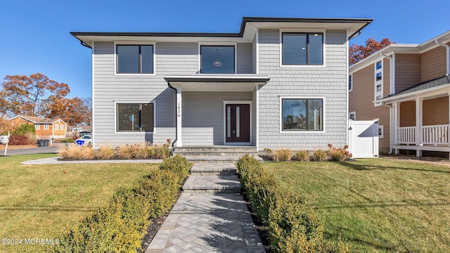 contemporary home with a front lawn