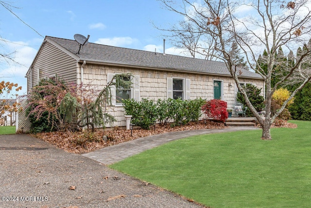 ranch-style house with a front yard