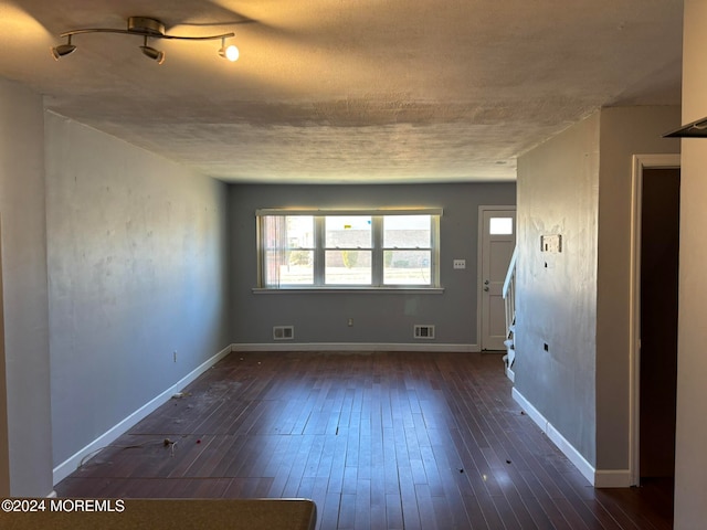 spare room with dark hardwood / wood-style floors