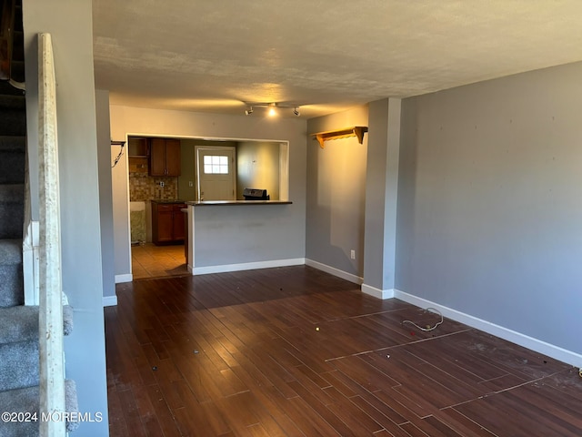 empty room with dark wood-type flooring