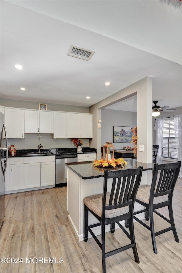 1801 Lilly Ln, Jackson, NJ 08527 - kitchen featuring dishwasher, light wood-style floors, a sink, white cabinets, and recessed lighting