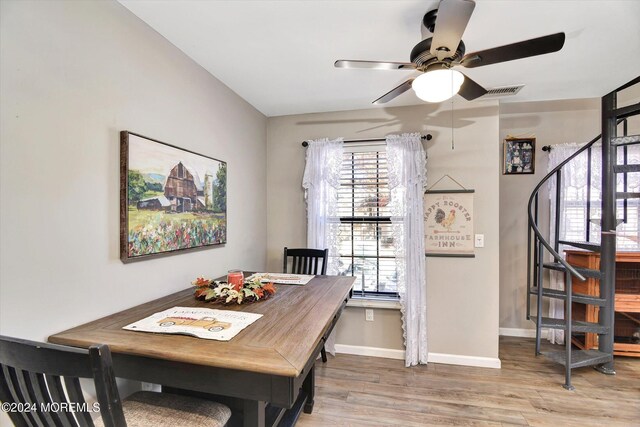 dining area featuring ceiling fan and hardwood / wood-style flooring