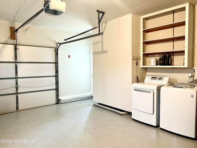 garage featuring washer and dryer and a garage door opener