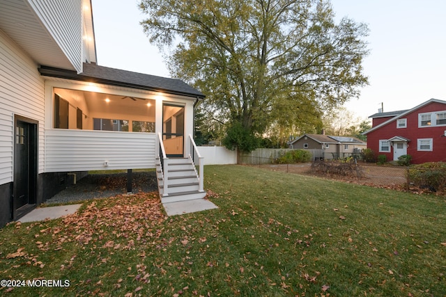 view of yard at dusk