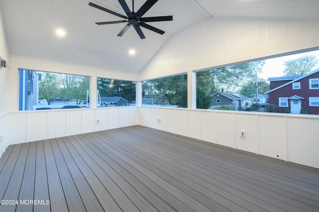 unfurnished sunroom with vaulted ceiling, ceiling fan, and a healthy amount of sunlight