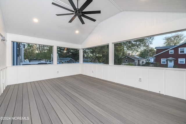 unfurnished sunroom with ceiling fan and lofted ceiling