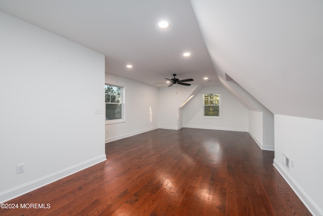 bonus room featuring dark hardwood / wood-style flooring, ceiling fan, and lofted ceiling