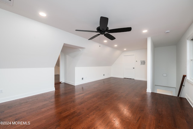 additional living space featuring ceiling fan, lofted ceiling, and dark wood-type flooring