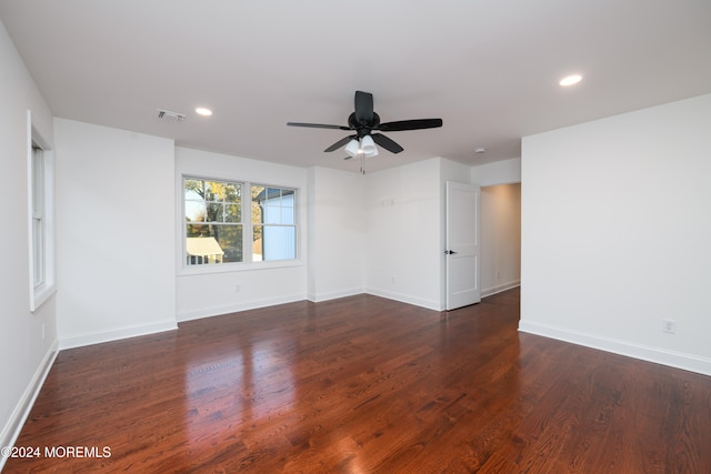 empty room featuring dark hardwood / wood-style floors and ceiling fan