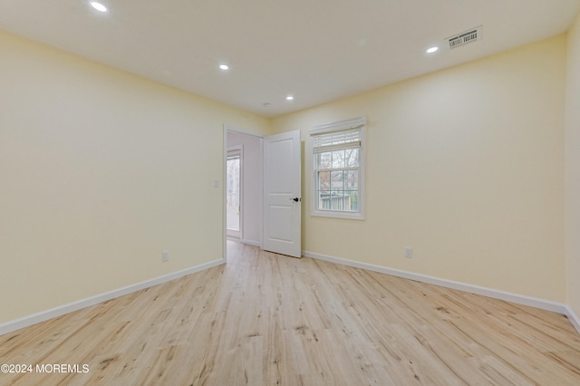 unfurnished room featuring light wood-type flooring