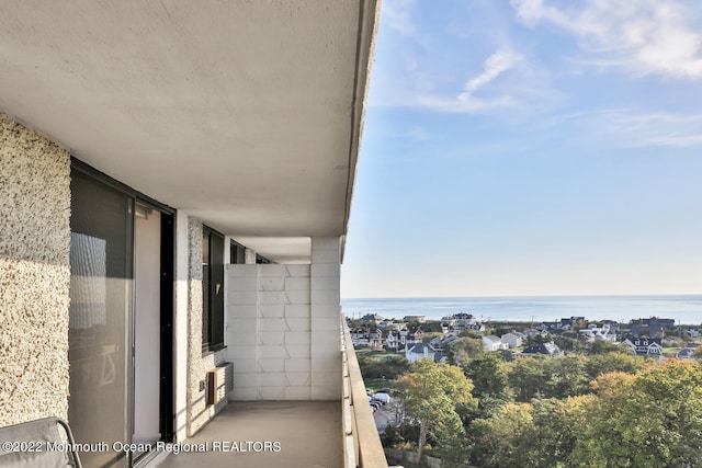 balcony featuring a water view