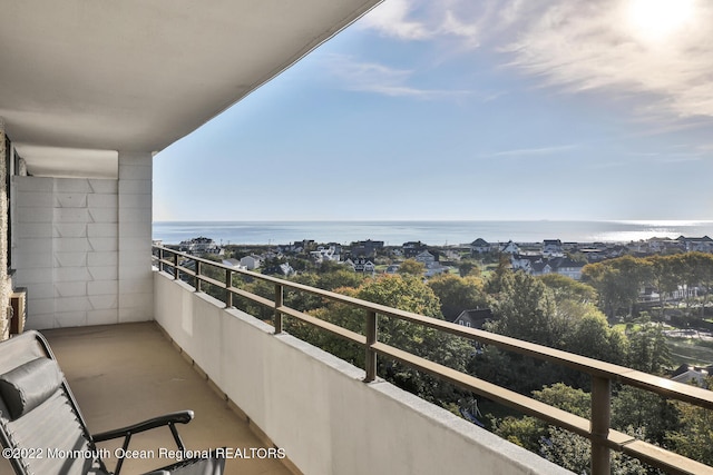 balcony featuring a water view