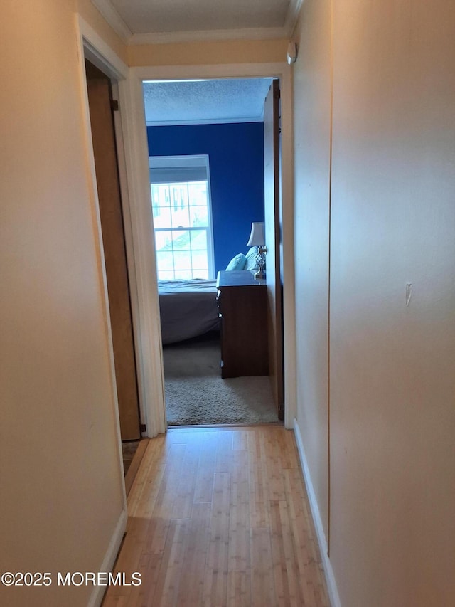 32 Village Rd, Morganville, NJ 07751 - corridor with wood finished floors and crown molding