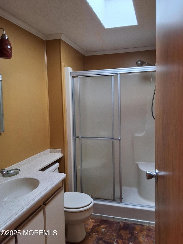 32 Village Rd, Morganville, NJ 07751 - bathroom featuring toilet, a stall shower, a skylight, vanity, and ornamental molding