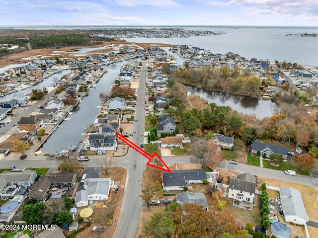 birds eye view of property featuring a water view