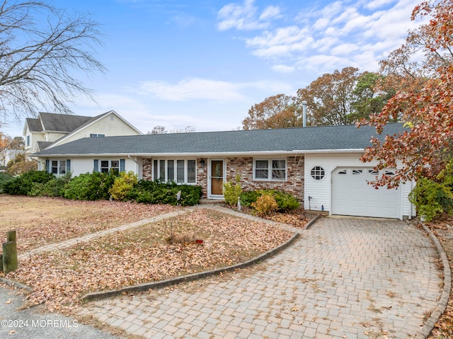 ranch-style home with a garage