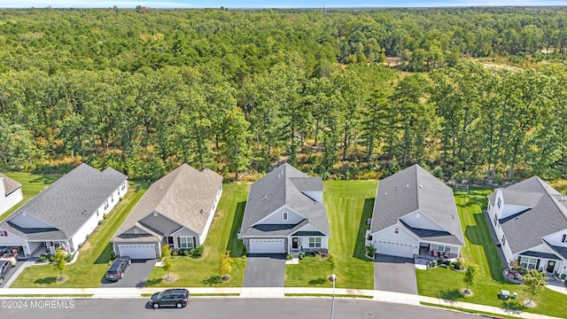 aerial view with a wooded view and a residential view