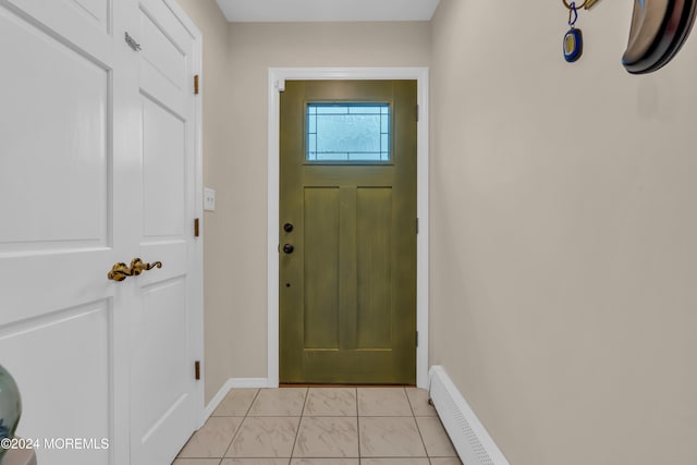 doorway to outside with a baseboard heating unit