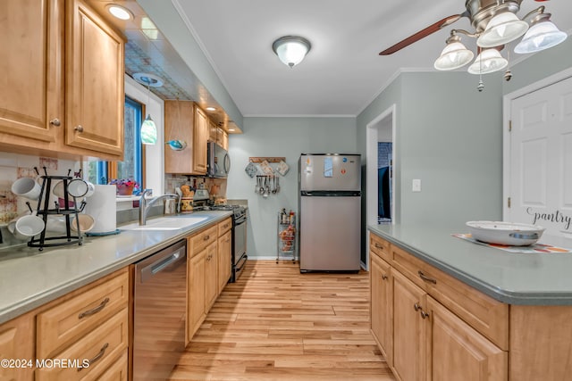 kitchen with ceiling fan, sink, light hardwood / wood-style flooring, black appliances, and ornamental molding