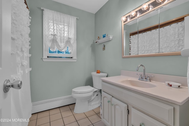 bathroom featuring tile patterned flooring, vanity, toilet, and baseboard heating