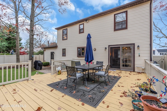 wooden terrace featuring grilling area