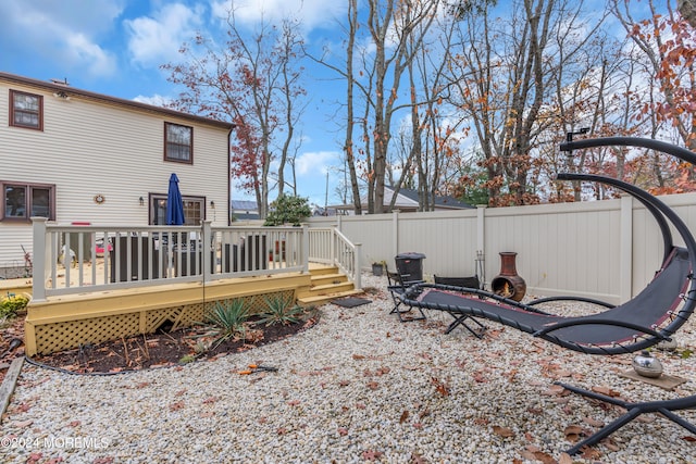 view of yard with a wooden deck