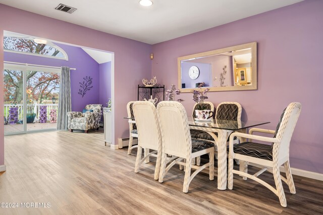 dining space featuring hardwood / wood-style flooring