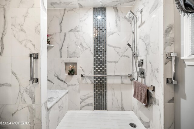 bathroom with a shower with shower door