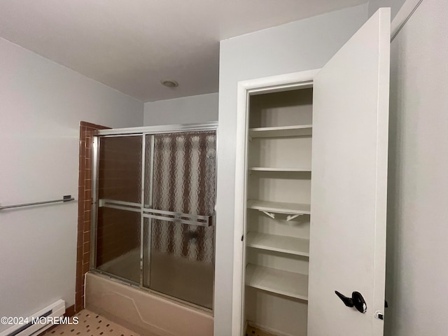 bathroom with bath / shower combo with glass door and a baseboard radiator