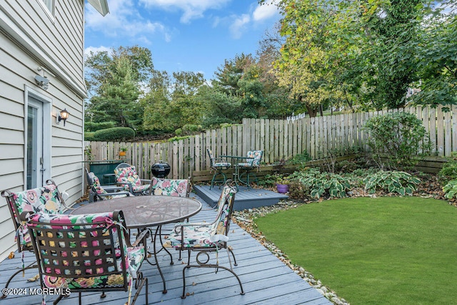 wooden deck with a yard