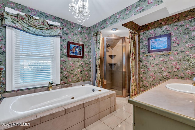 bathroom with a chandelier, vanity, independent shower and bath, and tile patterned flooring