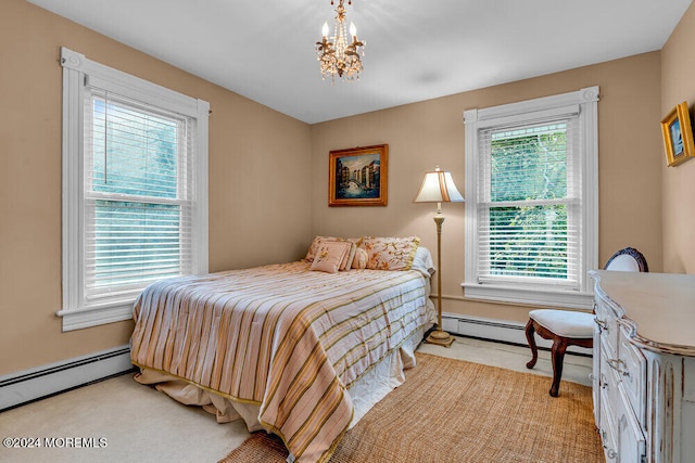 bedroom with baseboard heating and light carpet