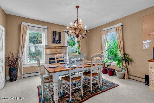 carpeted dining area featuring a chandelier, plenty of natural light, and a baseboard radiator