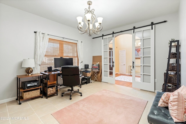 office area featuring tile patterned flooring, a notable chandelier, a barn door, and french doors