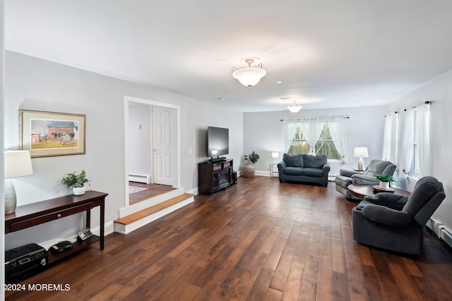 living room with baseboard heating and dark wood-type flooring