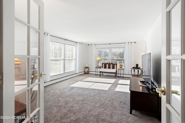 carpeted home office with french doors and a baseboard heating unit