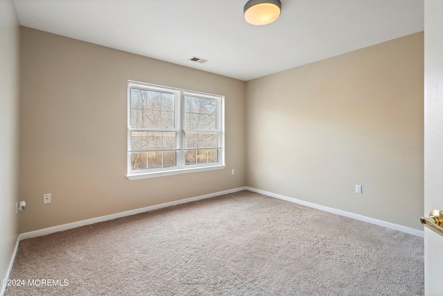 empty room featuring carpet flooring